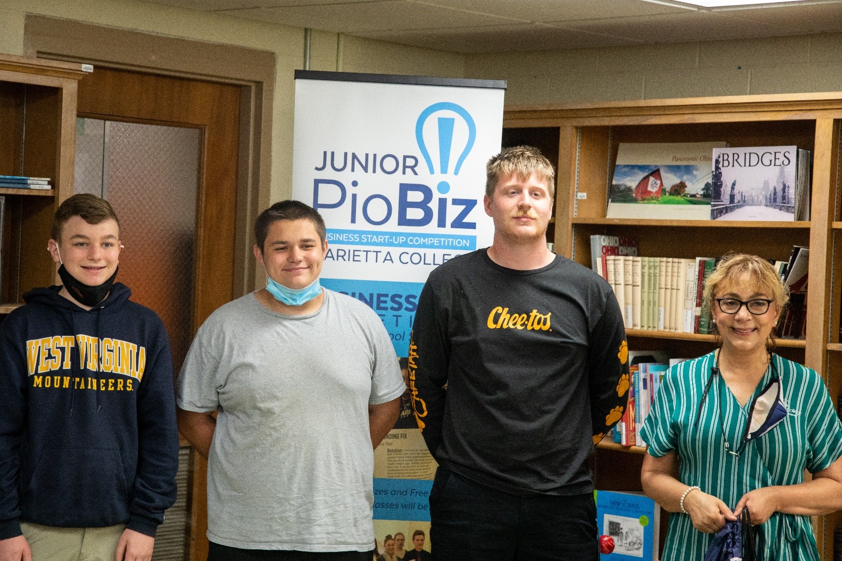 Dr. Khorassani visited Belpre High School to present the fifth-Place award to Christopher Clem, Trent Cox, Cody Daugherty and Cody Hess for their project “Project Mask On”.