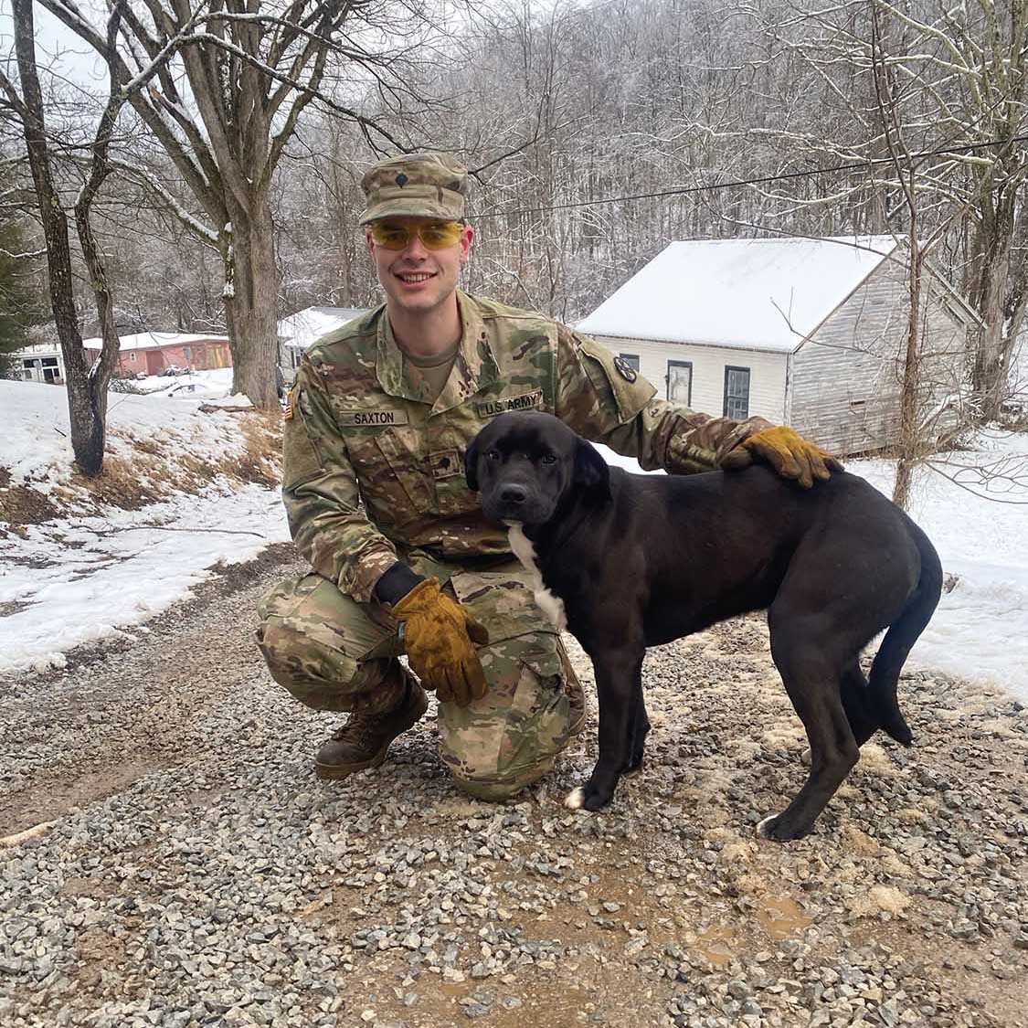 Wyatt Saxton poses with a dog