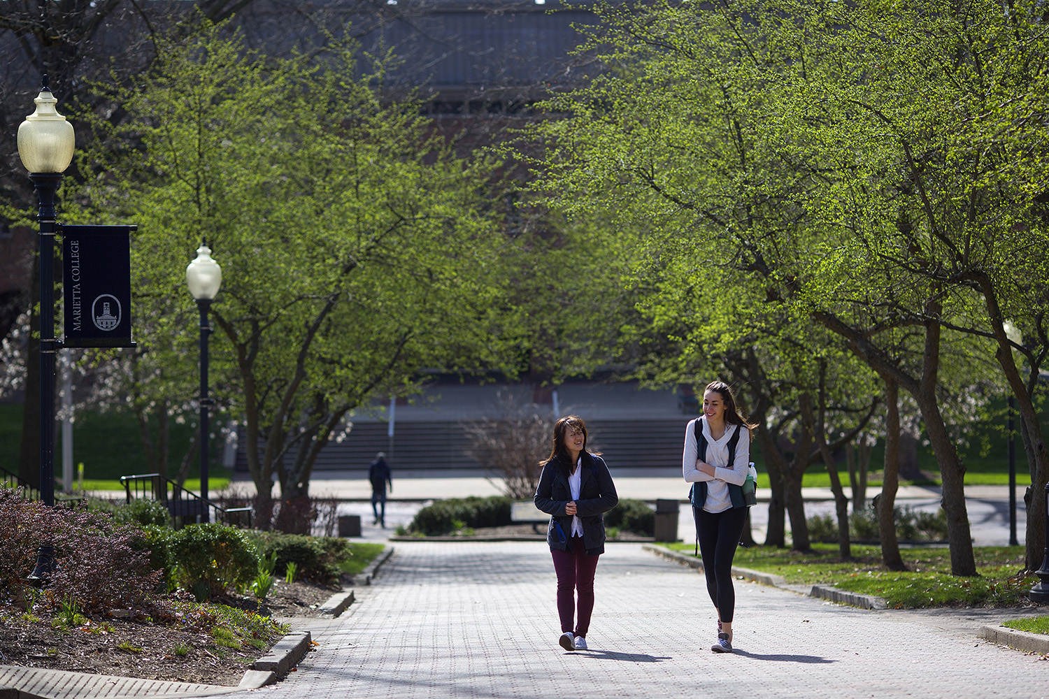 two students walk up Christy Mall