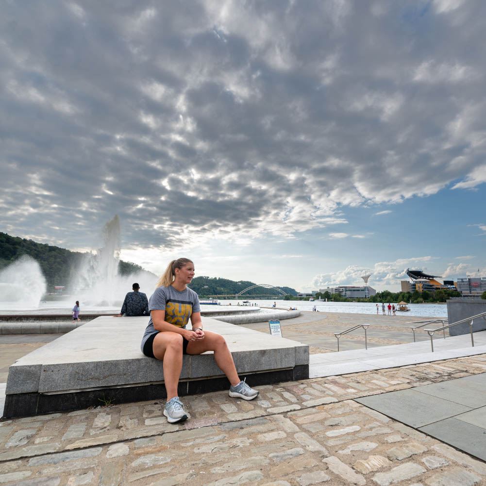 Amanda Hardt '13 sits in a Pittsburg Park