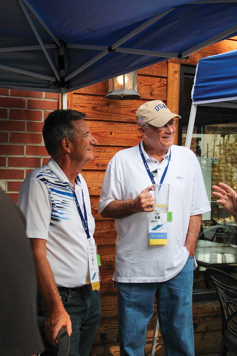 Chris Poskin ’70 and Lonnie Stock ’70 enjoy time with fellow Lambda Chi Alpha brothers during the annual Art Fordham Pig Roast at the Harmar Tavern