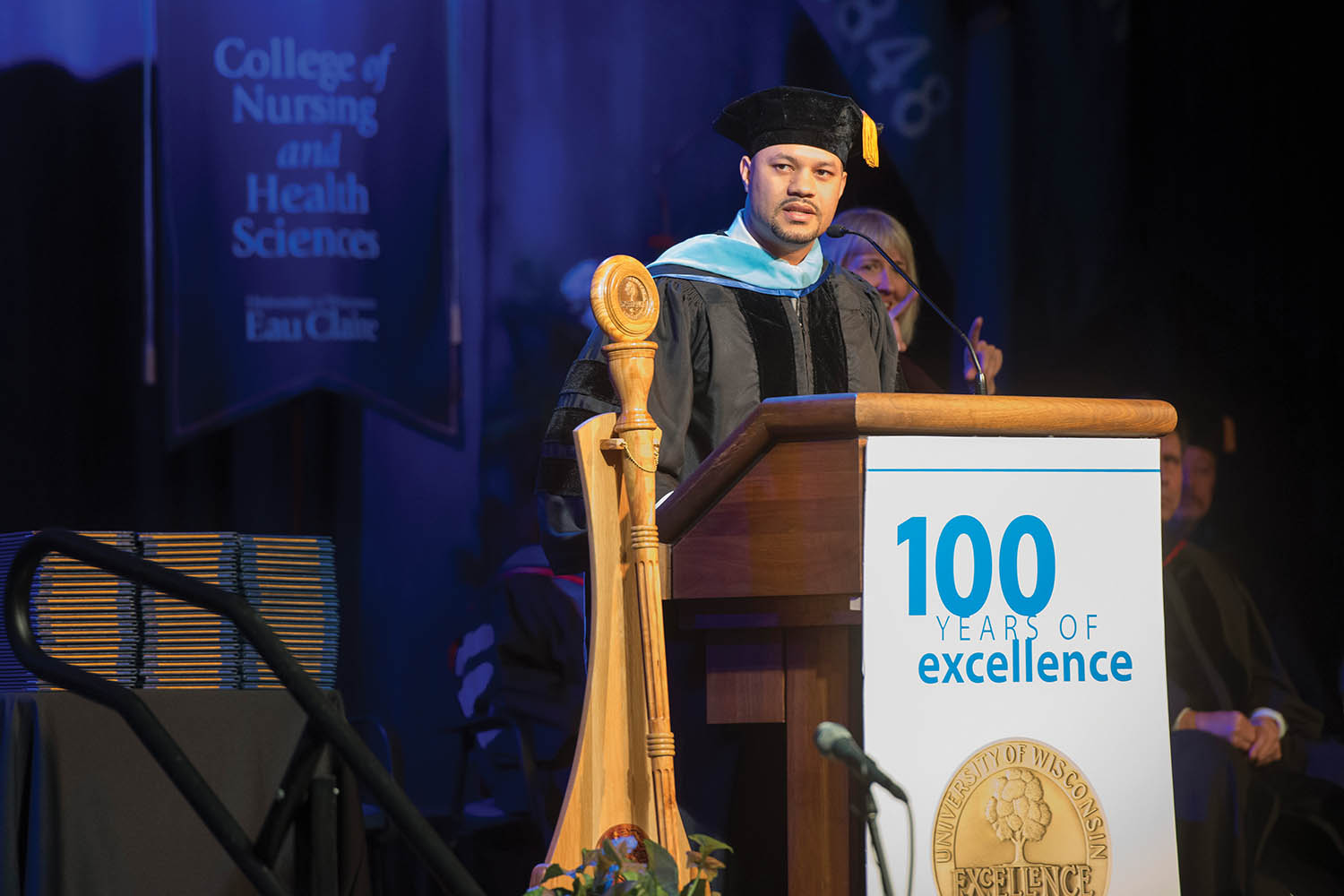 Dr. Joseph Webb '07 speaking at a graduation