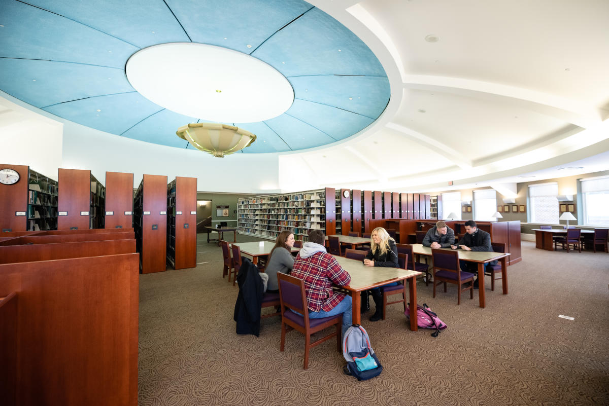 Students research on the 3rd floor of the library