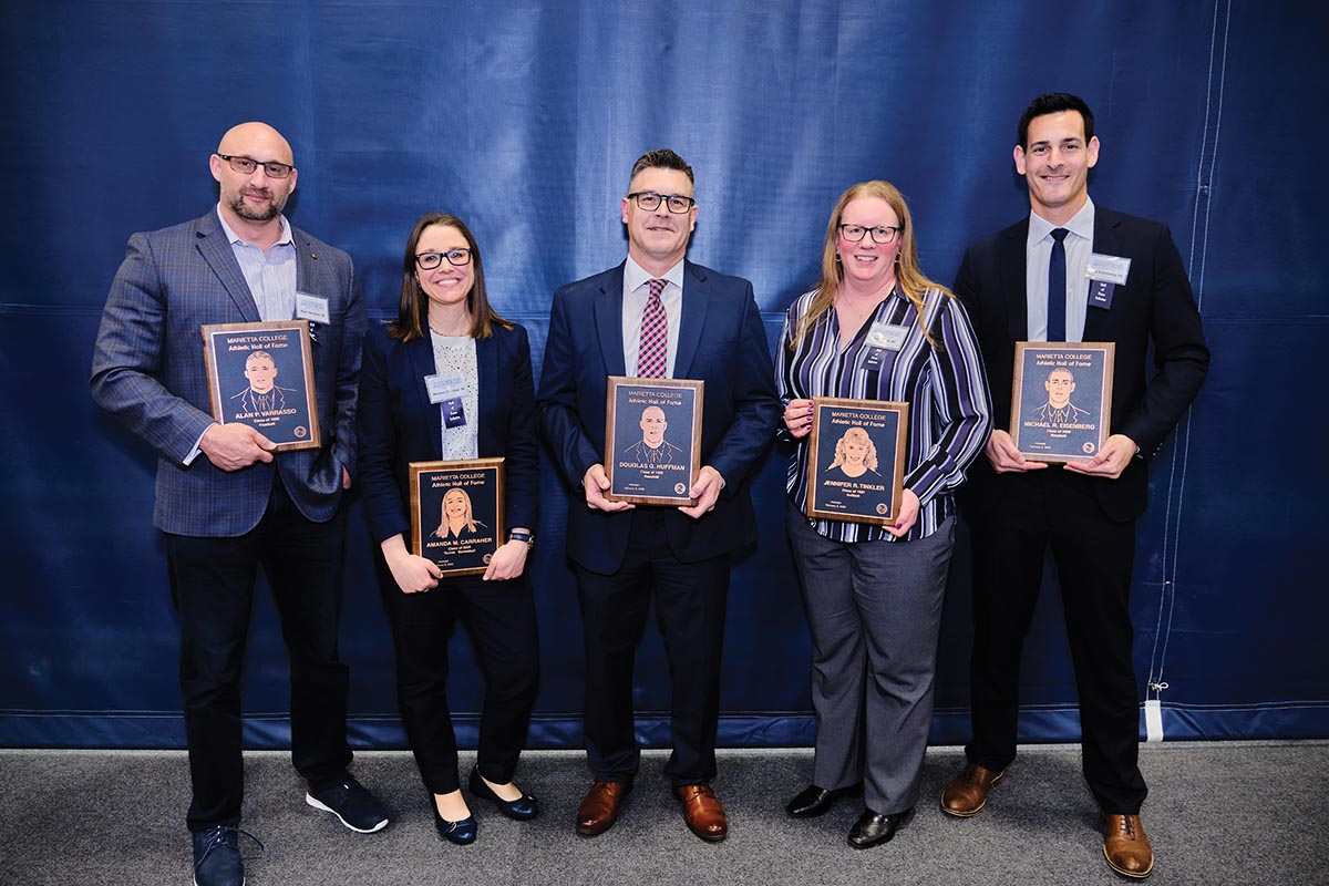 Marietta College 2020 Hall of Fame banquet group photo with award plaques