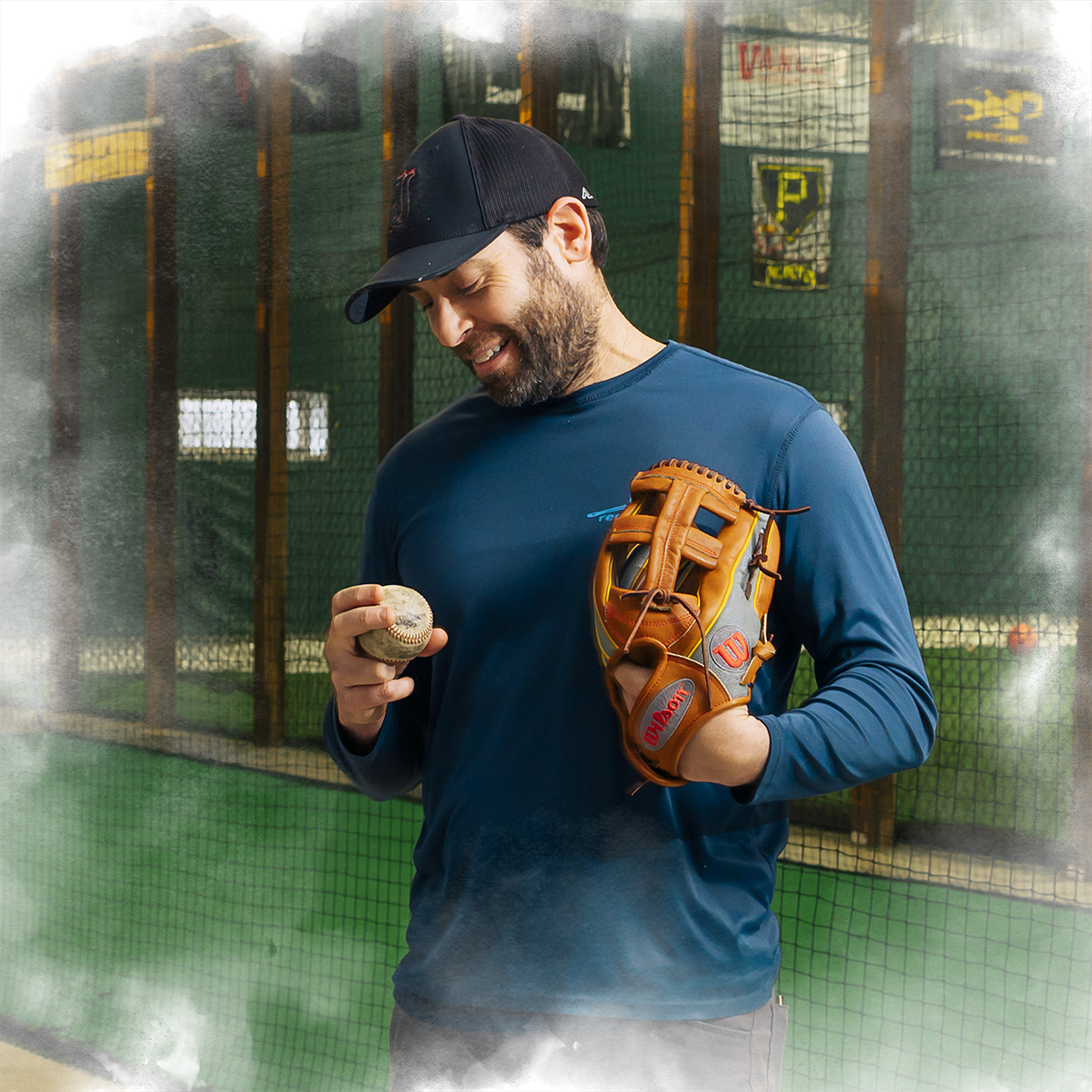 Matt DeSalvo '03 looks at his baseball and smiles