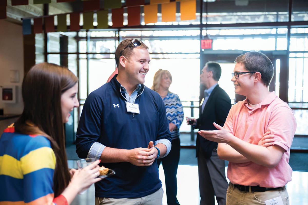 Lucy Welles ’17 speaks with Nick Brady ’15 and Taylor Myers ’15