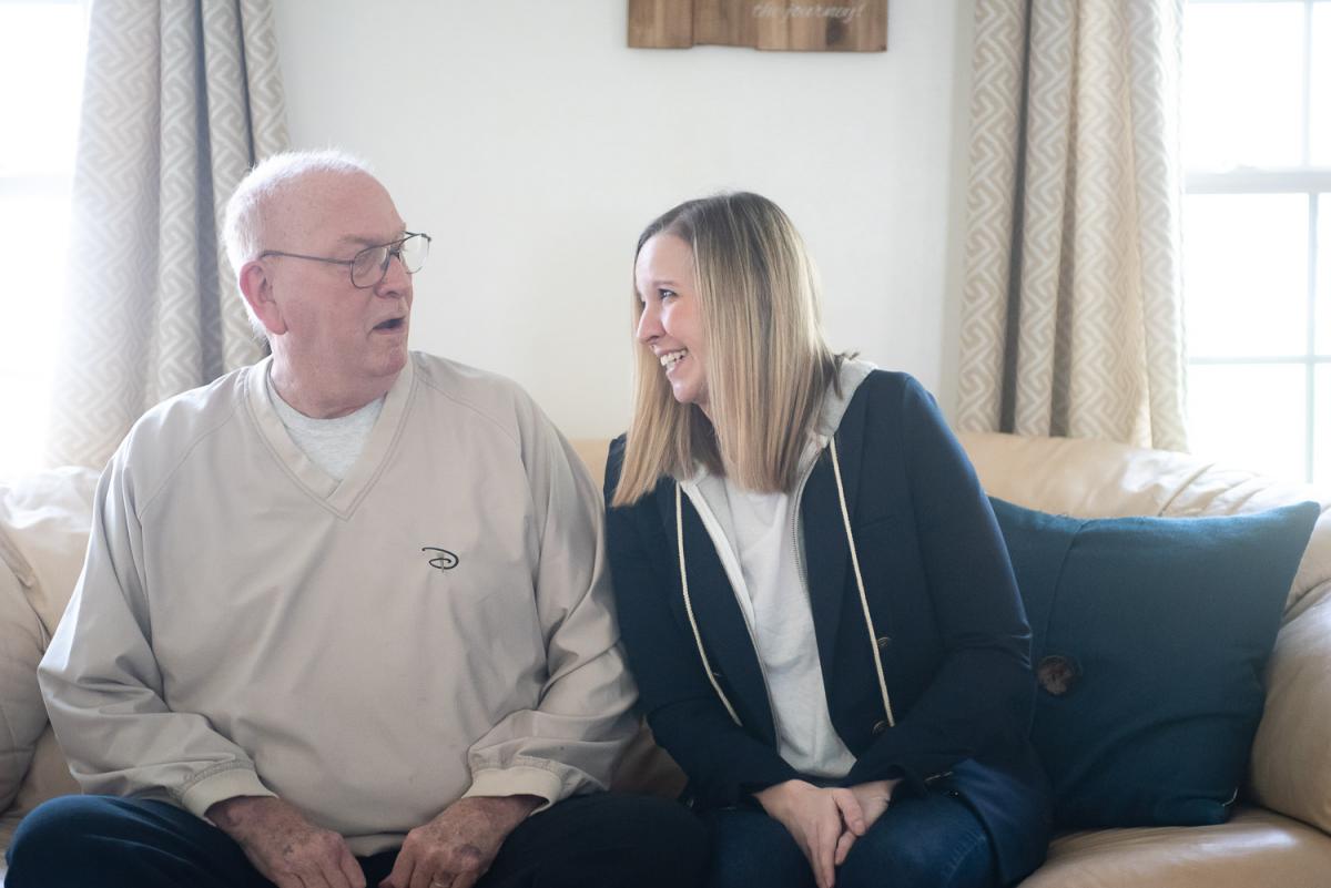 Hailee Stender '10 and her father in her home