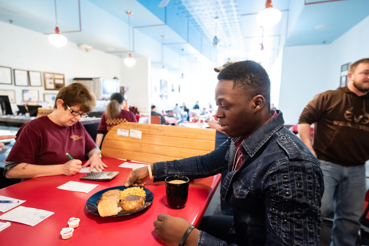 Bertrand Muhonga ’19 of Marietta College eats at local restaurant Tonyas Kitchen