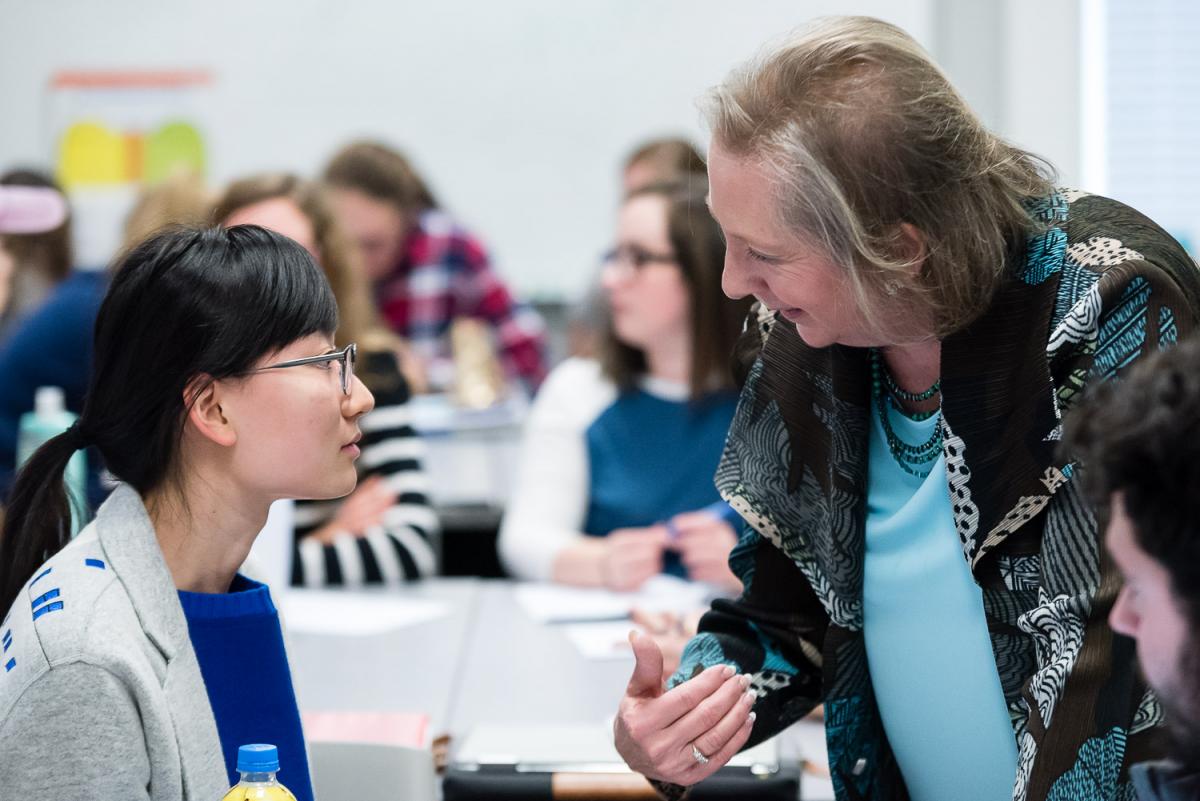 Dottie Herb one on one with a student in her Marietta College classroom