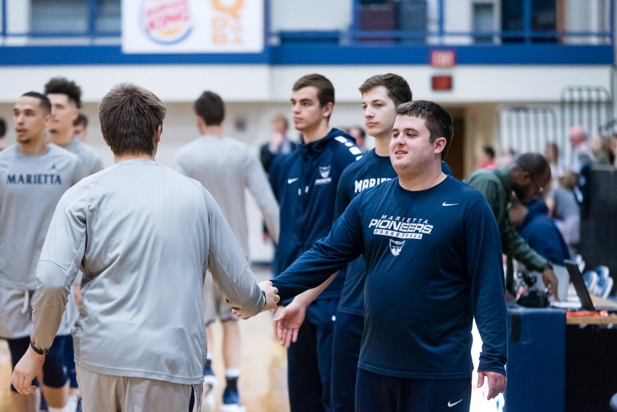 Noah helps hype up the Marietta College Mens Basketball Team