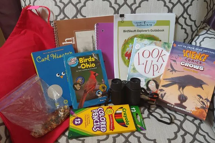 Books, crayons and other school supplies on a table