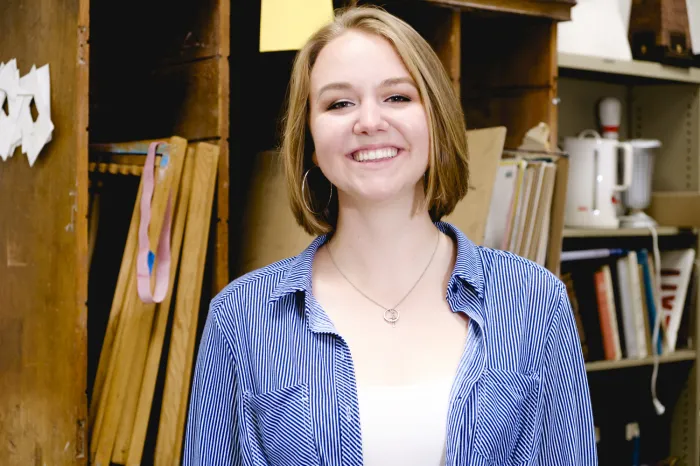 Leah Seaman smiling in art classroom