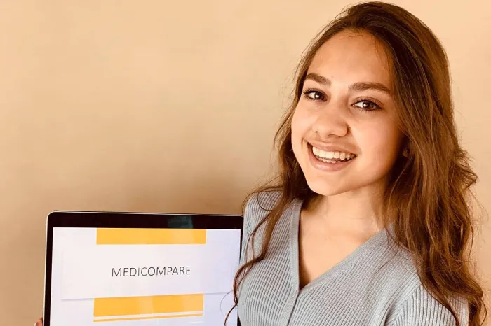 Sophia Nayak holding a laptop