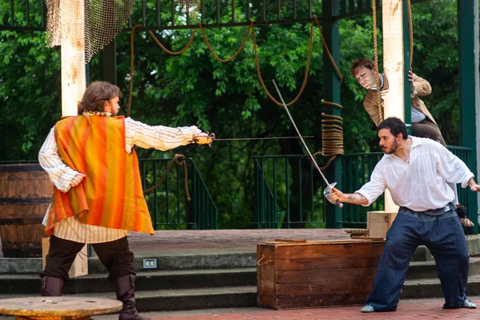 Actors sword fighting