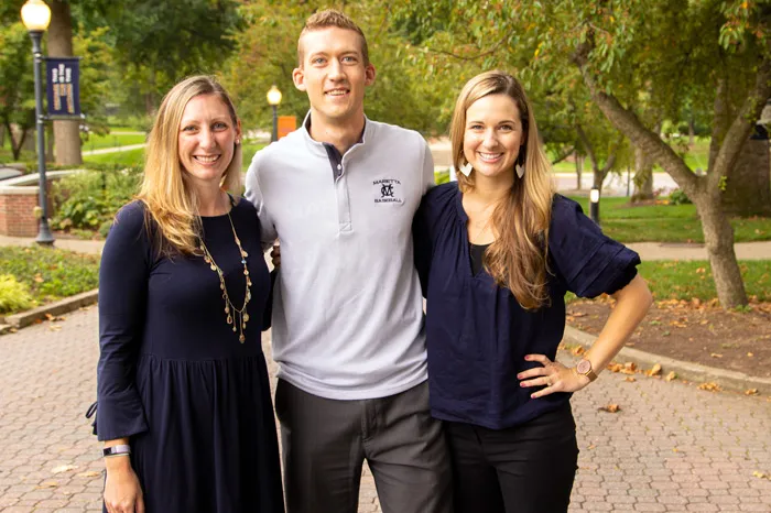 Three people standing together