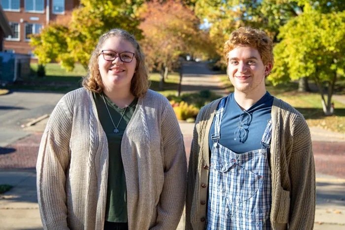 Two students posing on campus