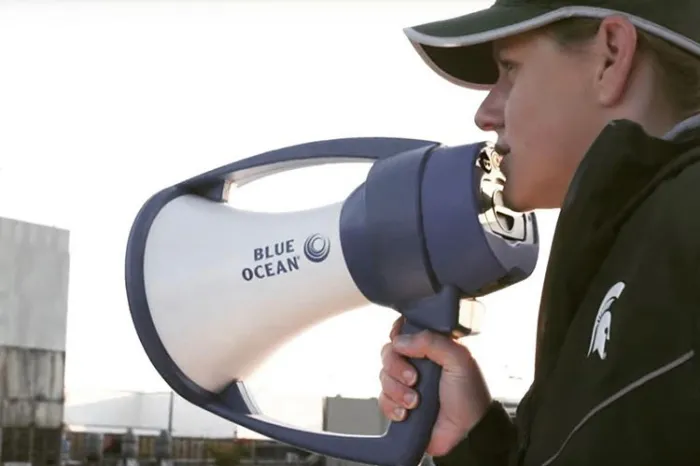 Kim Chavers speaking into a bullhorn