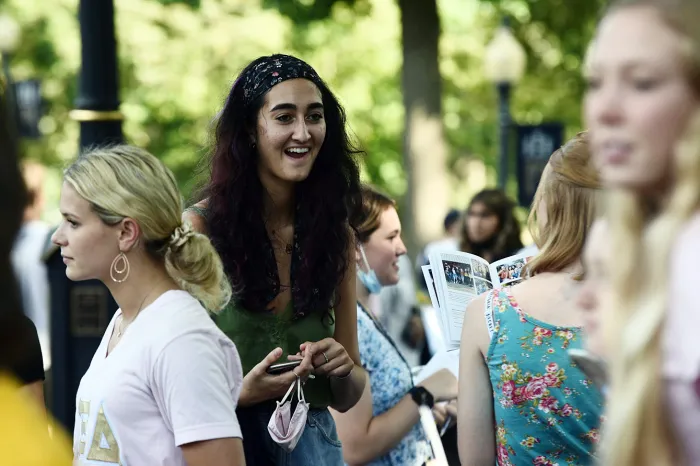 Auva Zandi outside on The Christy Mall with other students