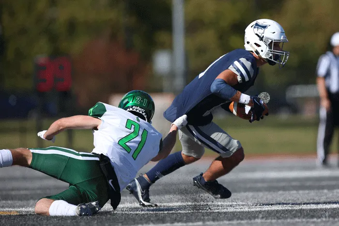 Receiver trying to break a tackle