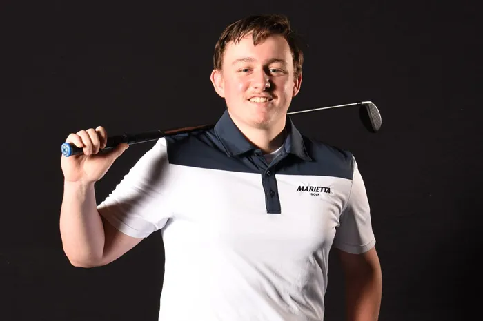 Male golfer with club over one shoulder