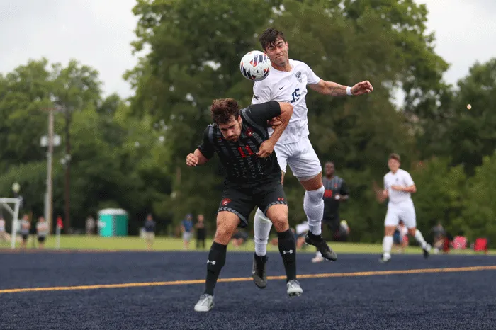 Soccer player heads the ball