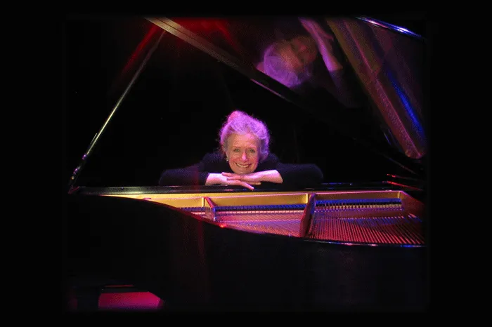 Barbara Nissman sitting at a piano