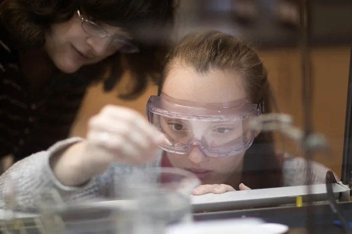 Chemistry student conducting an experiment