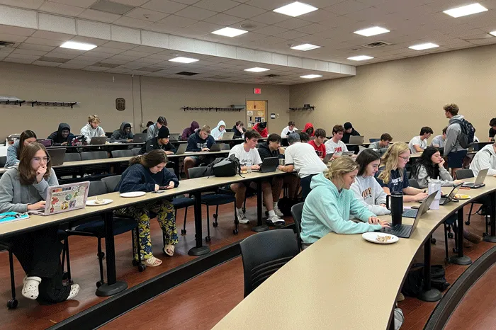 Students eating breakfast and registering for classes