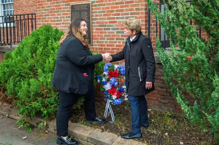 Maria Cipro and President Drugovich shake hands