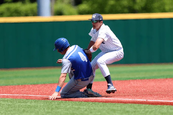 Marietta third baseman tagging out a runner