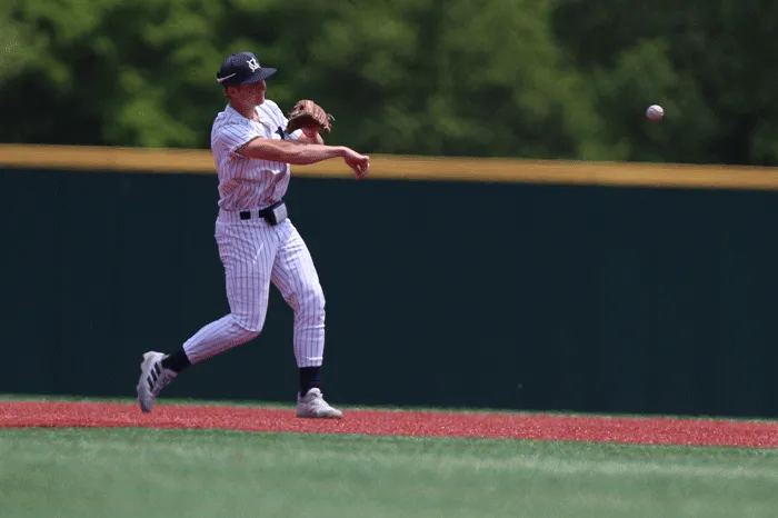 Infielder throwing to first base