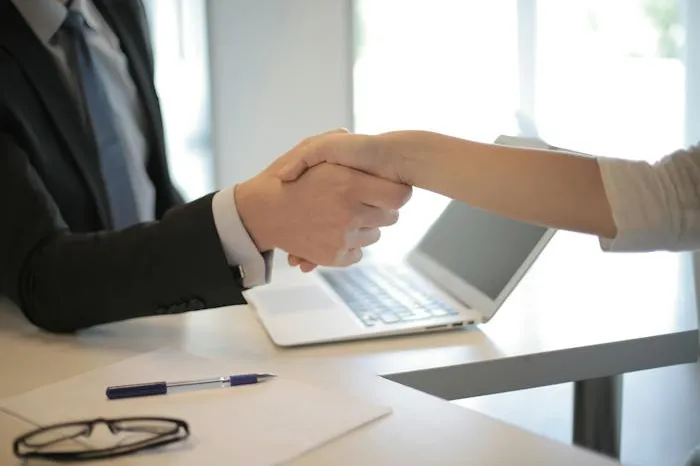 Man and woman shaking hands