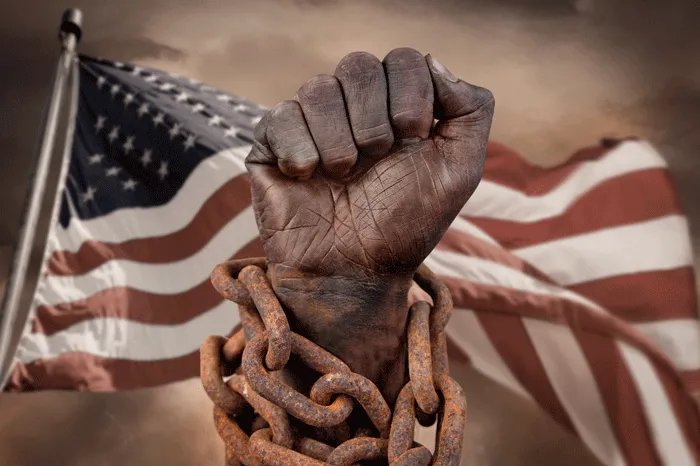 Black hand in chains with an American Flag