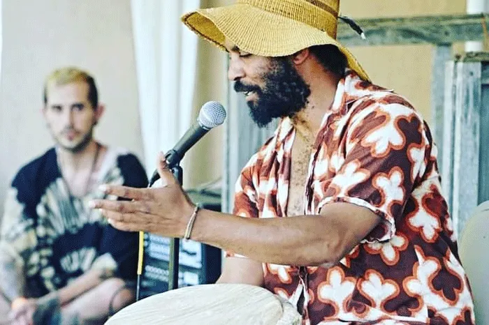 Lawrence Greene playing a drum