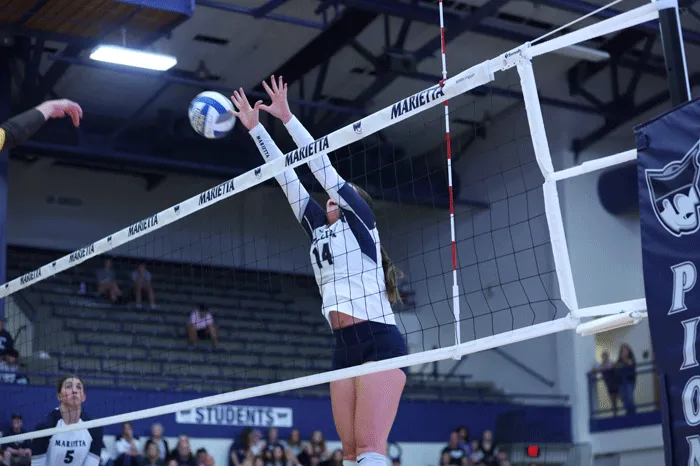 Volleyball player making a block