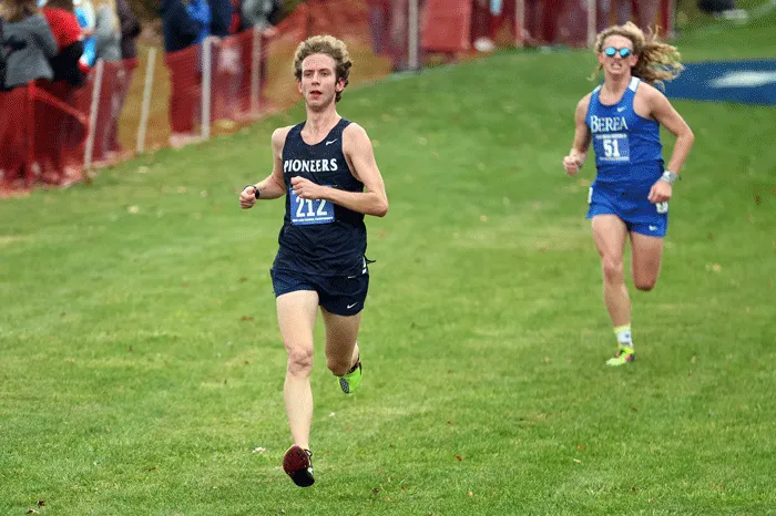 Runners racing down a hill