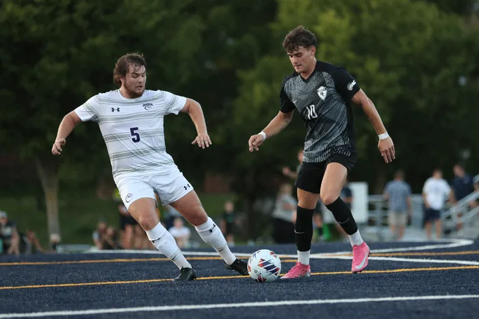 Marietta soccer player working the ball past a defender