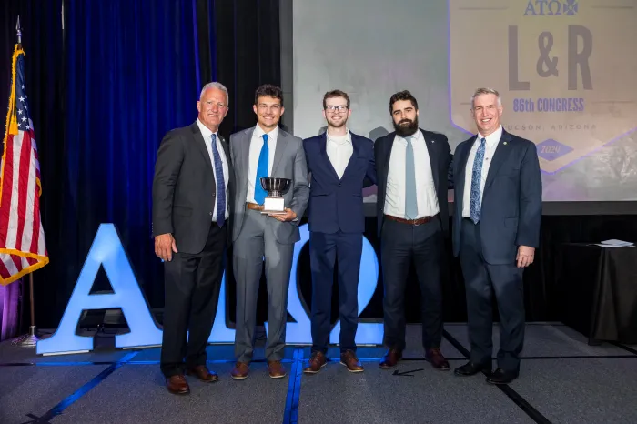Zack Riffle and Serj Wahl represent Marietta College's Alpha Tau Omega chapter during the 2024 Biennial Alpha Tau Omega Congress to receive the True Merit Award