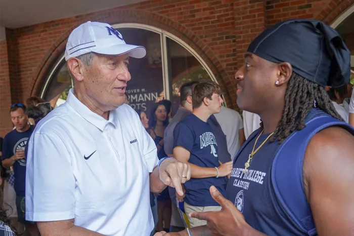 Joe Chlapaty chats with a student.