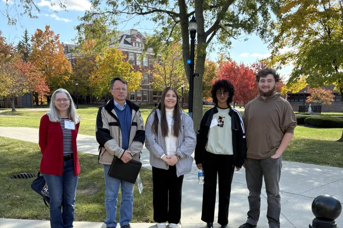 Dr. Kuhl, Dr. Bragg, and physics students attend the APS Conference