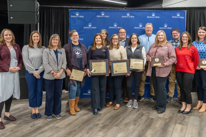 Award winners pose with awards