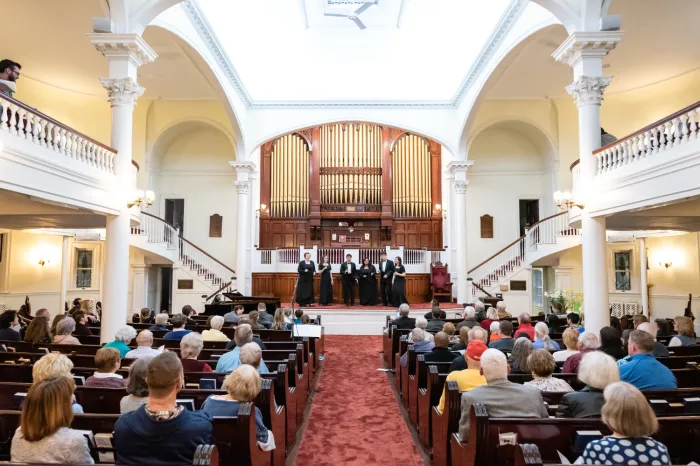 Wide shot from inside church during concert