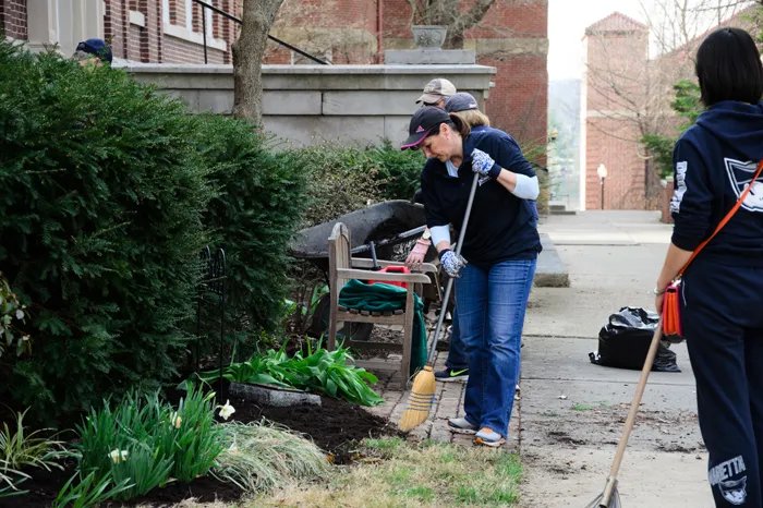 Employees and students cleaning campus