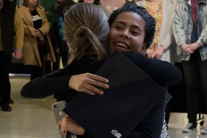 France Moise '20 hugs Professor Beth Nash