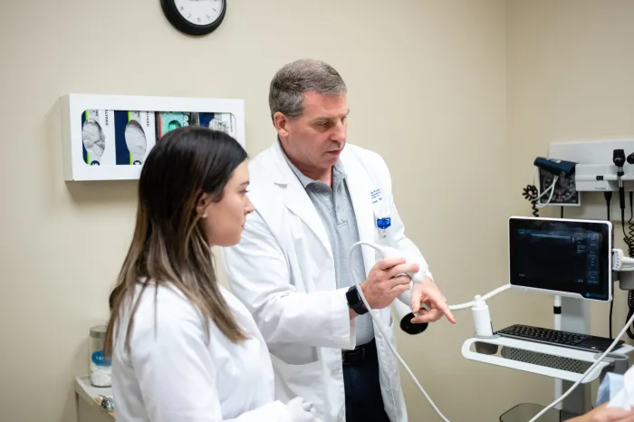 Dr. John Grosel demonstrates how to use an ultrasound machine