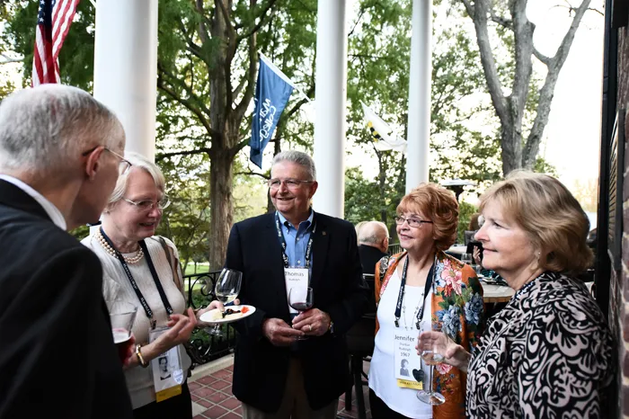 Members of the Class of 1967 gather at homecoming