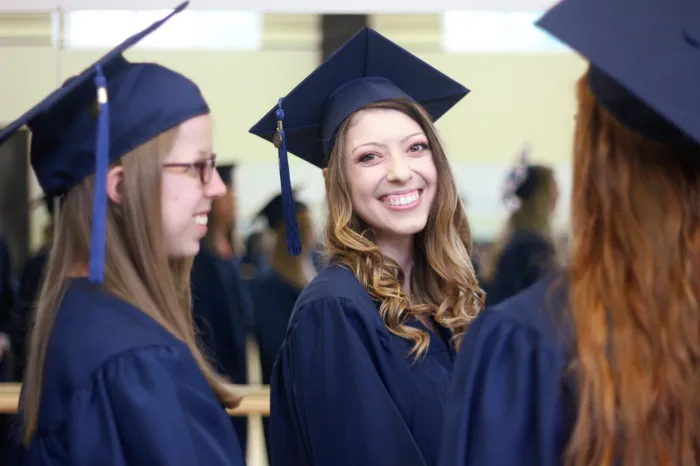 PA students smile and laugh during the graduation ceremony