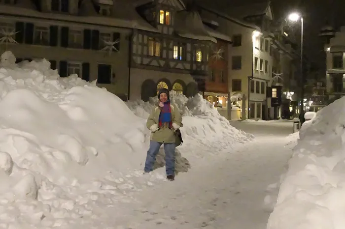 Grace Johnson standing in the snow in Switzerland