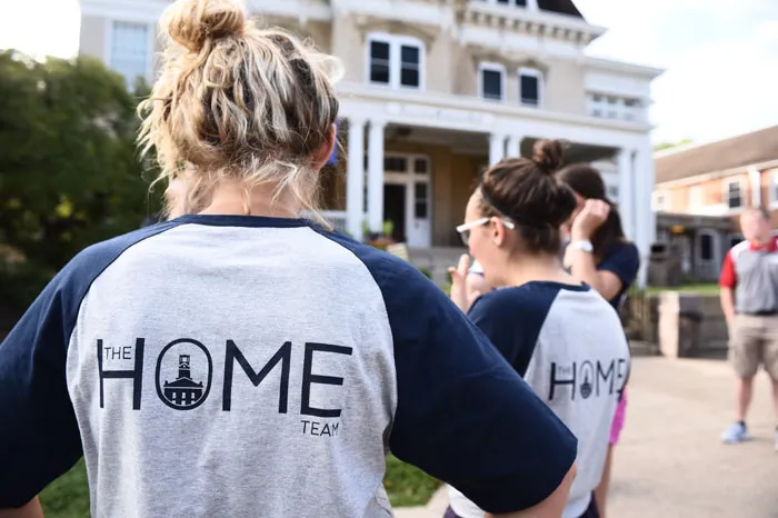 Students wearing HOME T-shirts