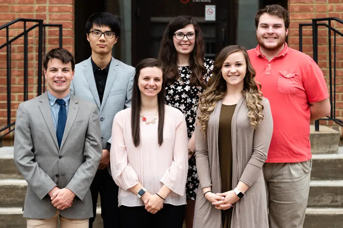 Six Marietta students standing in front of McDonough steps